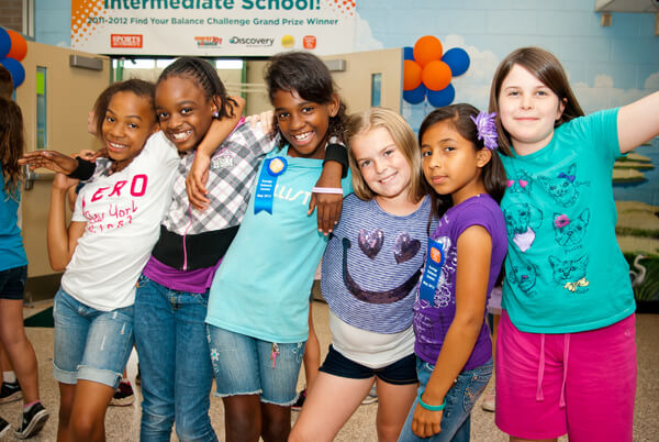 Girls smiling together at school